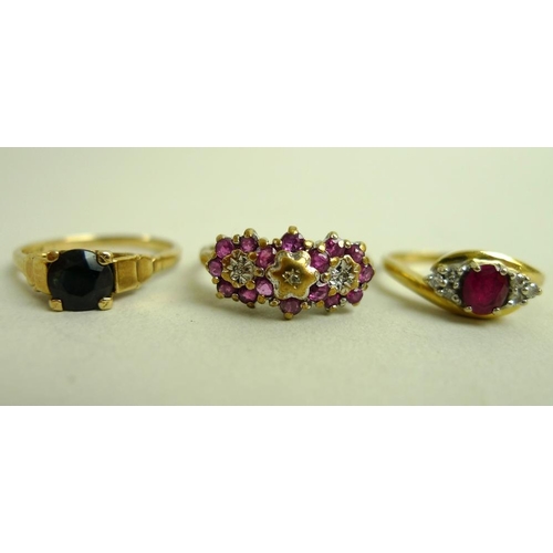 915 - An 18ct gold, platinum, ruby and diamond dress ring, the central oval cut ruby flanked by two sets o... 