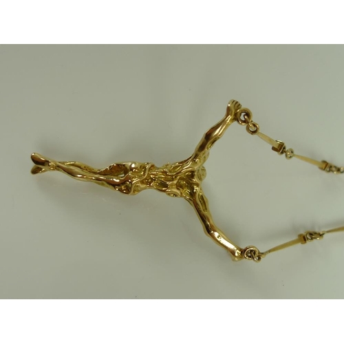 916 - After Salvador Dali: an 18ct gold crucifix necklace after the painting 'The Christ of Saint John of ... 