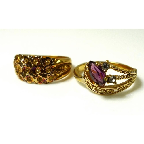 919 - An 18ct gold ring the wide band cast with a garland of flowers, size M, 4.5g, together with a 14K go... 