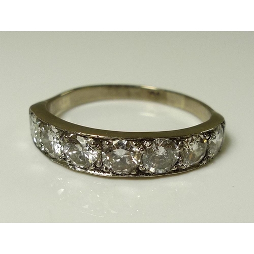 922 - An 18ct white gold and diamond dress ring, set with seven large brilliant cut stones, totalling appr... 