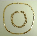 A 9ct gold bar necklace, formed of twenty two alternating smooth and textured bars, 40 cm long, toge... 