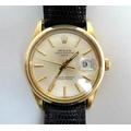 An 14K gold cased Rolex Oyster Perpetual Date gentleman's wristwatch, circa 1960, the oyster dial wi... 