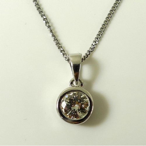 935 - An 18ct white gold and diamond solitaire pendant, approx 0.75ct, bezel setting with 18ct white gold ... 