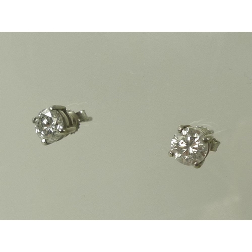 936 - A pair of impressive 18ct white gold and diamond ear-studs, each approximately 0.75ct, 5.75mm diamet... 