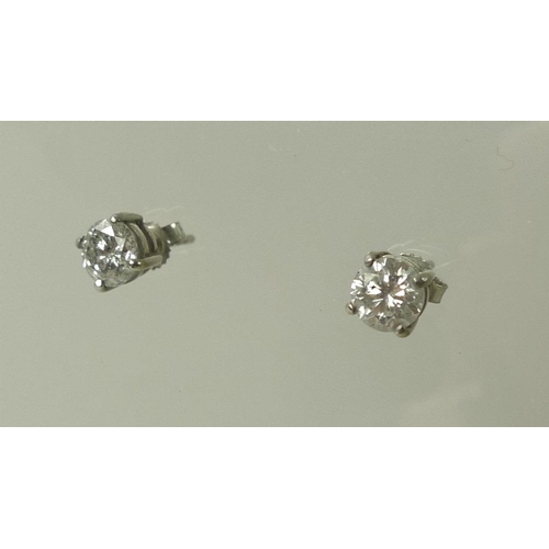 936 - A pair of impressive 18ct white gold and diamond ear-studs, each approximately 0.75ct, 5.75mm diamet... 