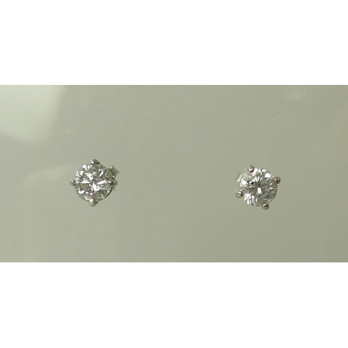 936 - A pair of impressive 18ct white gold and diamond ear-studs, each approximately 0.75ct, 5.75mm diamet... 