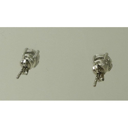 936 - A pair of impressive 18ct white gold and diamond ear-studs, each approximately 0.75ct, 5.75mm diamet... 