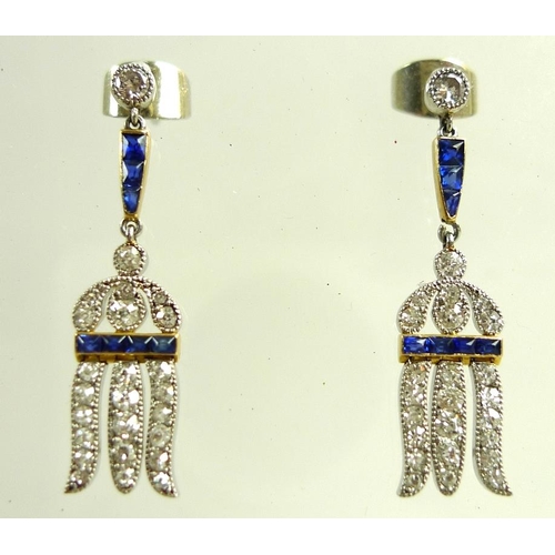 937 - A pair of 1930's Art Deco diamond and sapphire earrings, of drop hare-bell design, each earring form... 