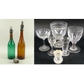 A collection of Victorian and later glassware, comprising two coloured glass bottles with silver and... 