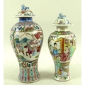 Two Chinese famille rose porcelain vases and covers, Qing Dynasty 19th century, each painted with ce... 