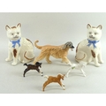 A group of ceramic figurines, comprising a Beswick figure modelled as a running Afghan hound, 21 by ... 