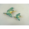 A Beswick wall plaque, modelled as a kingfisher, impressed number 729-1, flying right, green/yellow,... 