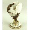 A Royal Worcester nautilus shell with applied salamander, the stem formed as coral and seaweed, base... 