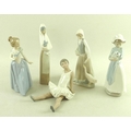 A collection of Nao figures, comprising girl holding puppy, 25cm, girl with goose, 25cm, girl with l... 