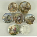 A collection of 19th century pot lids, comprising Cattle by Ruins, with gold rim, 12.5cm, and The Fl... 