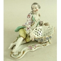 A Meissen porcelain figural sweetmeat dish, circa 1880, modelled as a young gallant recumbent and ho... 