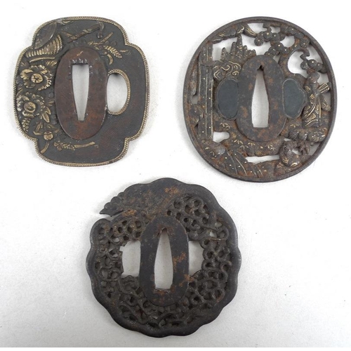 768 - A group of three Japanese tsuba, 19th and early 20th century, the first of mokkogata shape, cast in ... 