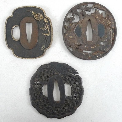 768 - A group of three Japanese tsuba, 19th and early 20th century, the first of mokkogata shape, cast in ... 