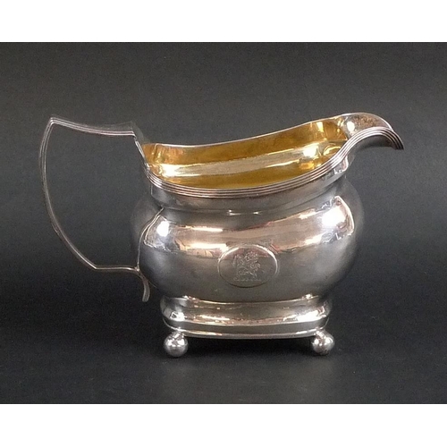 775 - A George III silver cream jug, ribbed rims to boat shaped body, oval cartouche to one side engraved ... 