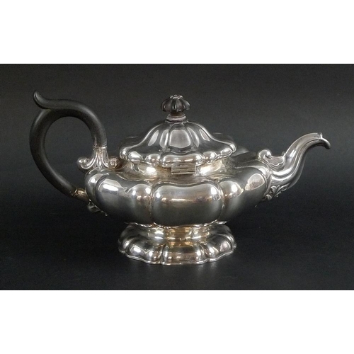 776 - A late 19th / early 20th century silver teapot styled as a Tudor Rose, the sinuous spout with chased... 