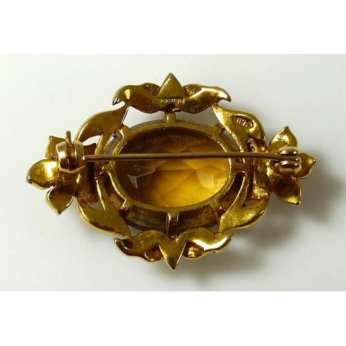 786 - A Victorian 9ct gold brooch set with large oval cut citrine and surrounded by seed pearls, marked to... 