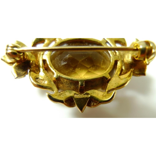 786 - A Victorian 9ct gold brooch set with large oval cut citrine and surrounded by seed pearls, marked to... 