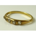 A 14ct gold ring set with five old cut diamonds, approx 0.2ct total diamond weight, band mis-shapen,... 