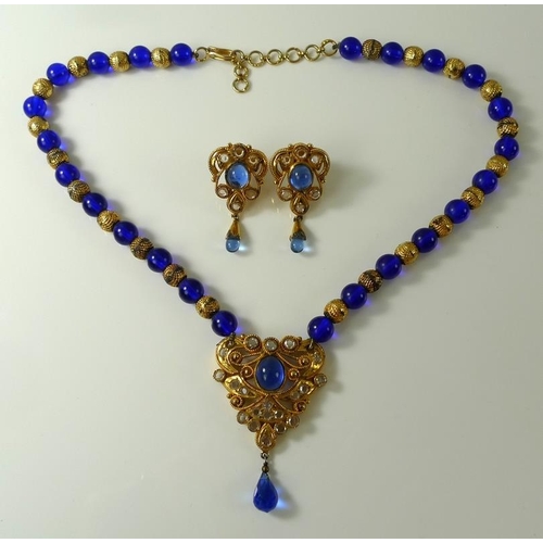 808 - An Indian kundan crystal and gold plated necklace, formed of alternating blue glass and textured gol... 