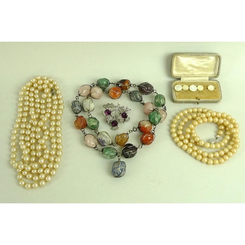 810 - A large quantity of costume jewellery, including glass beads, a Murano style glass cross pendant, se... 