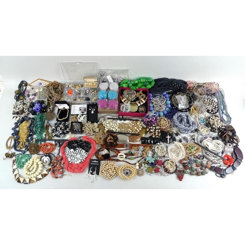 810 - A large quantity of costume jewellery, including glass beads, a Murano style glass cross pendant, se... 