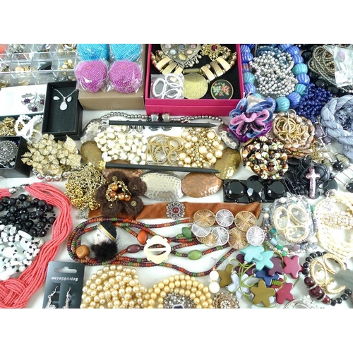 810 - A large quantity of costume jewellery, including glass beads, a Murano style glass cross pendant, se... 