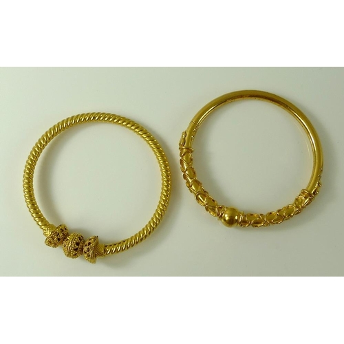 811 - Two Bengal bangles, gold plated, one of a rope twist design, 52.8g. (2)