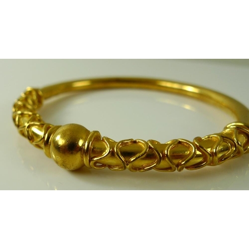 811 - Two Bengal bangles, gold plated, one of a rope twist design, 52.8g. (2)