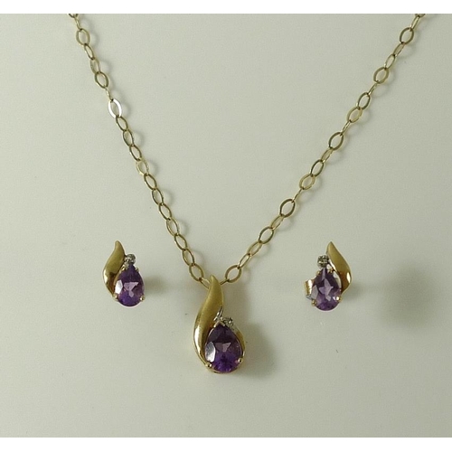 812 - A 9ct and amethyst necklace, of cross over design  with central pear cut amethyst crowned with a dia... 