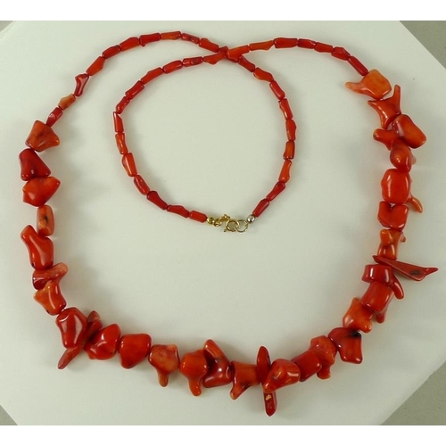 818 - A red fire coral necklace of organic form, with 9ct and 9K gold clasp, 73cm, 79g, with presentation ... 