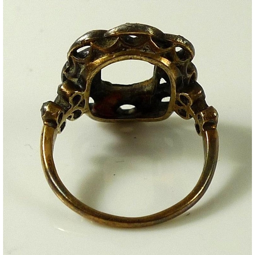 819 - A 19th century gold and diamond rope twist ring, the open set rectangular frame with open twist sett... 