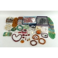 A group of silver and vintage and later costume jewellery, including amber necklaces, bracelets and ... 