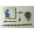 A group of jewellery, comprising a sterling silver fox and whip brooch, 4g, a white metal brooch set... 