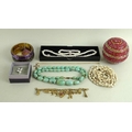 A large quantity of costume jewellery, including glass beads, rose quartz and green quartz, coral co... 