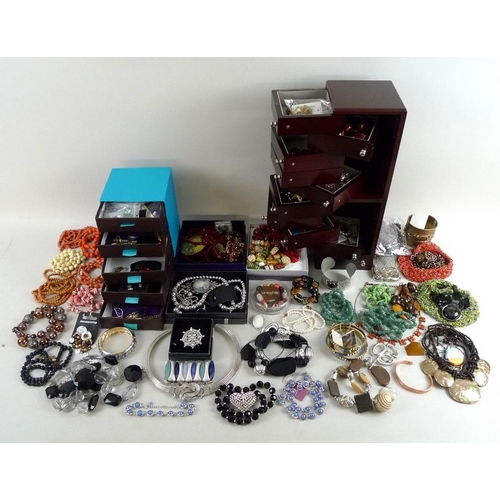 831 - A large quantity of vintage and later costume jewellery, including a locket, a jade cross, ceramic a... 