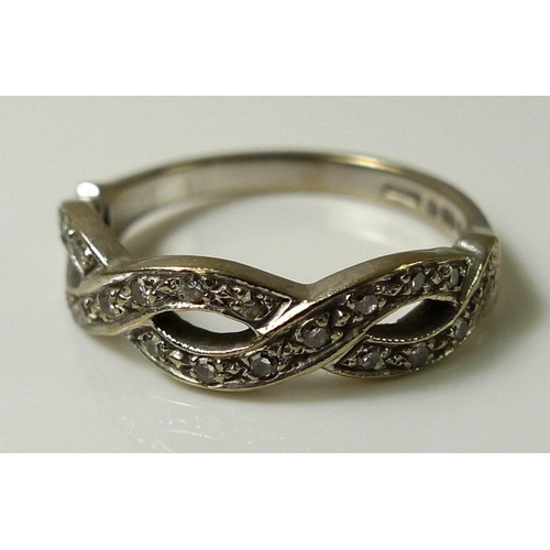 839 - An 18ct white gold and diamond ring, half the band formed of a spiralling double helix set with 22 d... 