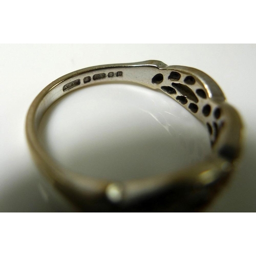 839 - An 18ct white gold and diamond ring, half the band formed of a spiralling double helix set with 22 d... 