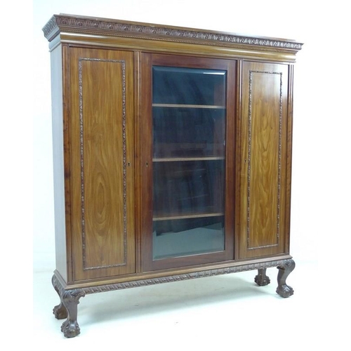 931 - A good Edwardian mahogany bookcase, outswept cornice with foliate carved decoration, beading and cus... 