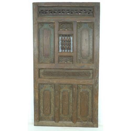 937 - A set of Moorish carved wooden doors, possibly 19th century, carved with motifs, 99 by 6 by 187.5cm ... 