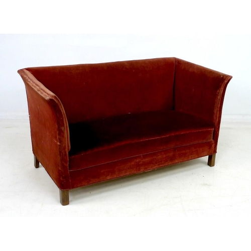 941 - An Edwardian two seater settee, with gently outswept sides, sprung seat and short square section leg... 