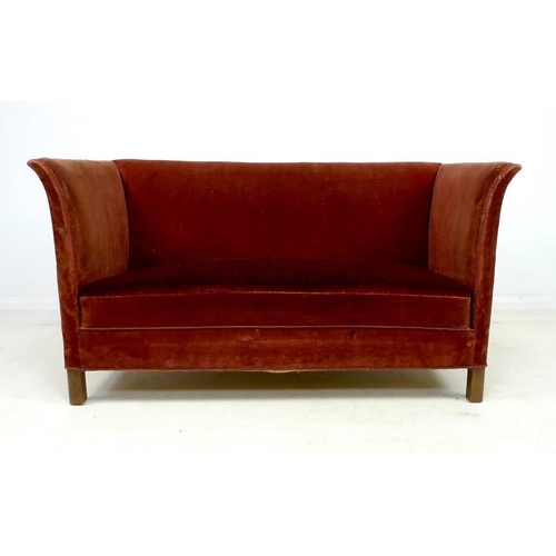 941 - An Edwardian two seater settee, with gently outswept sides, sprung seat and short square section leg... 