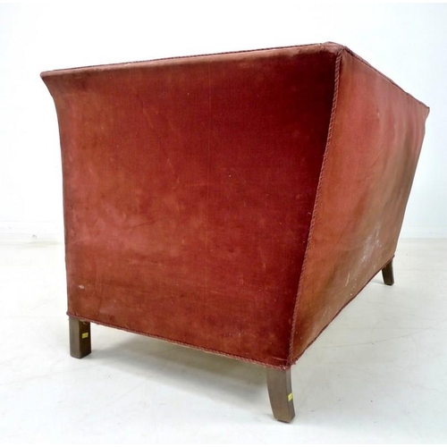 941 - An Edwardian two seater settee, with gently outswept sides, sprung seat and short square section leg... 