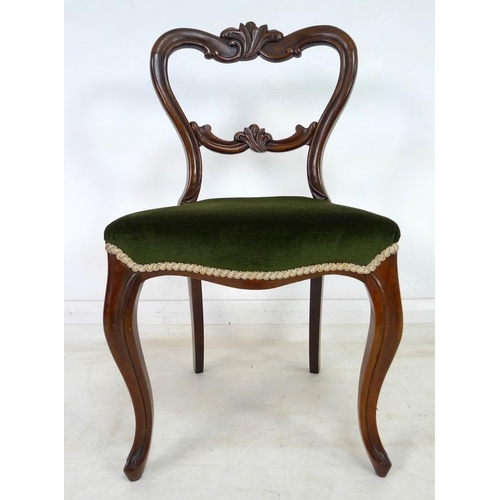 942 - A set of six Victorian rosewood dining chairs, with carved rails and moulded frames, upholstered in ... 