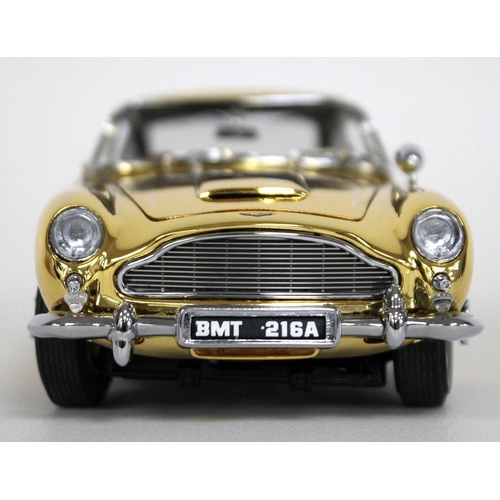 303 - A 1/24 scale 22 carat gold plated die cast and ABS plastic replica model Aston Martin DB5, by Danbur... 