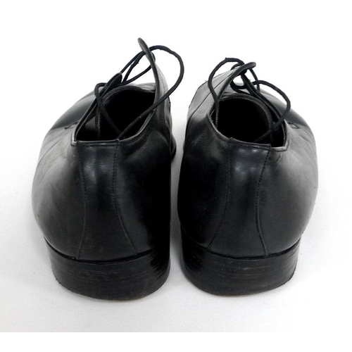 325 - A pair of black leather shoes worn by Roger Moore, retailed by Simpson of Piccadilly by Bally of Swi... 